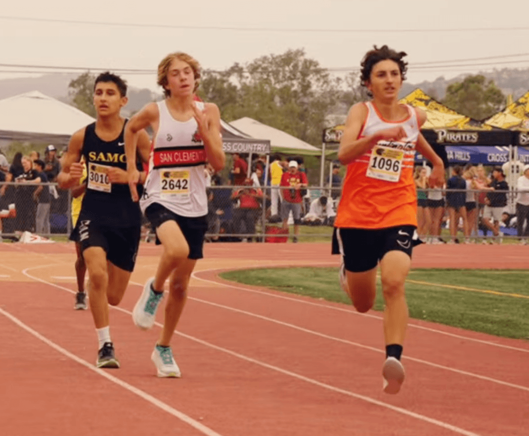 Me sprinting the final stretch of my first cross country race, visibly dying